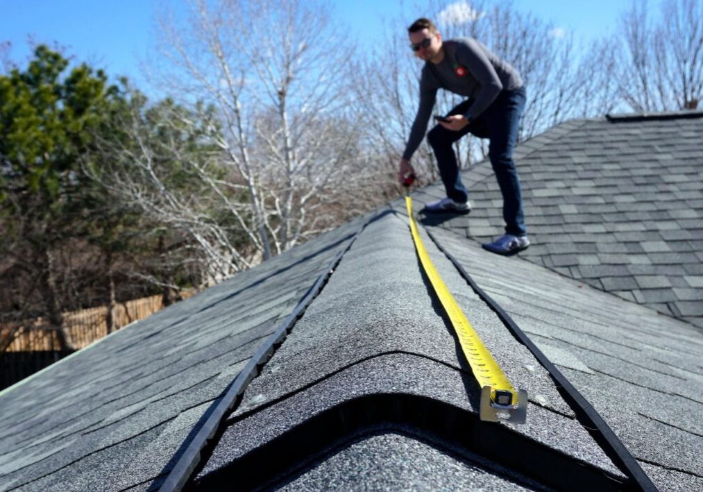 a roofer ensuring safety compliance during roofing inspections in stockton
