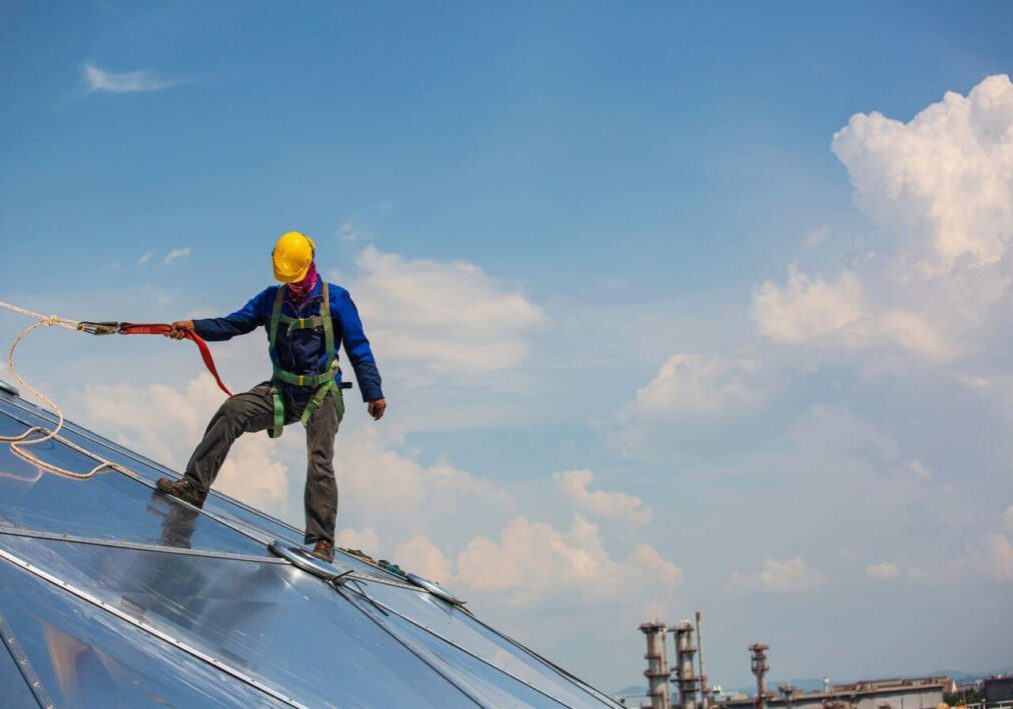 roofer with safety harness in stockton